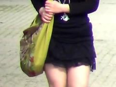 Asian pissing outdoors in public