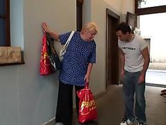 Young guy helps old granny