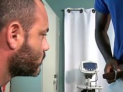 Mature gay doctor takes his patient's big black dick at the office