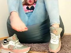 After the depilation, a young nymph masturbates pussy in jeans