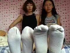 2 japanese women under sneakers